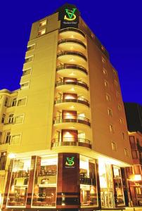 a large hotel building with a sign on it at SV Bussiness Hotel Taksim in Istanbul