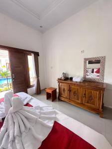 Кровать или кровати в номере Memela Bungalow +7 фотографий