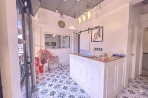 a kitchen with a counter in a room at Auberge Petit Hotel San Juan La Union in san juan la union
