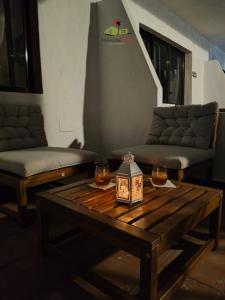 a living room with a coffee table and a couch at Casa Gala in Corralejo