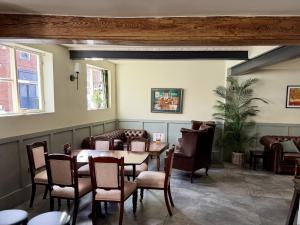 a dining room with a table and chairs at Old Grey Mare in York
