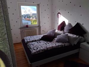 Ένα ή περισσότερα κρεβάτια σε δωμάτιο στο Ferienwohnung Anke Günther +34 φωτογραφίες