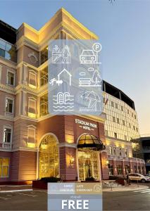 a building with writing on the side of it at Stadium Park Hotel in Odesa