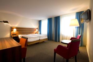 Ein Bett oder Betten in einem Zimmer der Unterkunft Hotel Astoria