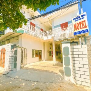 a house with a motel sign in front of it at Huyền Anh Motel Cam Ranh in Cam Ranh