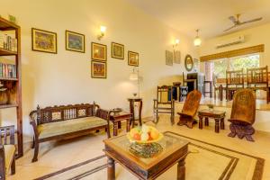 a living room filled with furniture and a table at Royale Holiday Villa - 4BHK JAQK Holidays in Baga +39 photos