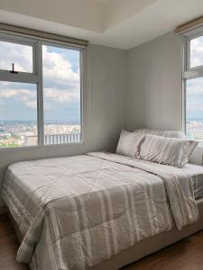 Ένα ή περισσότερα κρεβάτια σε δωμάτιο στο Luxury 3BR Podomoro Suite Medan City View NEW! +12 φωτογραφίες
