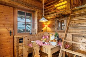 a dining room with a table in a log cabin at Chalet Bergliebe in Brilon