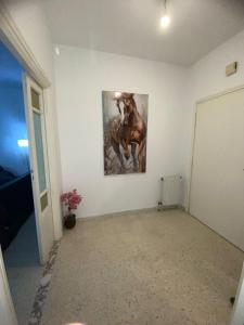 a room with a painting of a horse on the wall at Bardo centre in Tunis