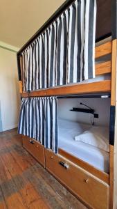 a bunk bed with two bunk beds in a room at Rossio Hostel in Lisbon