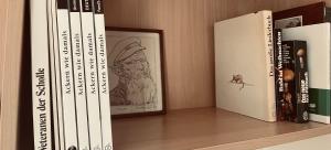 a shelf with a bunch of books on it at ZU HAUSE Pfalz in Bad Dürkheim