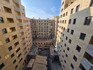 an overhead view of an alley between two tall buildings at Your Yerevan Home in Yerevan