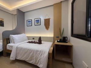 Ένα ή περισσότερα κρεβάτια σε δωμάτιο στο Inngo Tourist Inn