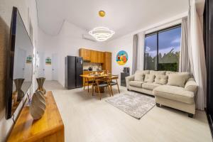 a living room with a couch and a table at Oasis Pandawa 10A - Private Luxury Awaits - Newly Built Villa with Pool in Ungasan