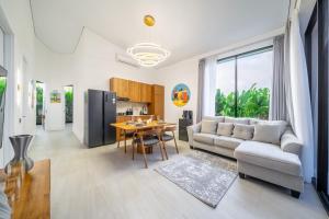 a living room with a couch and a table at Oasis Pandawa 10A - Private Luxury Awaits - Newly Built Villa with Pool in Ungasan
