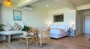 Postel nebo postele na pokoji v ubytování Secret Sunrise