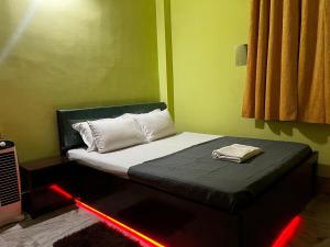 Postel nebo postele na pokoji v ubytování JG Homestay