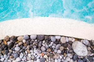 a pile of rocks on a beach near the water at Hotel Relais Pian delle Starze in Marina di Camerota