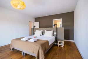 Postel nebo postele na pokoji v ubytování Casa Luminosa by Portugal Portfolio