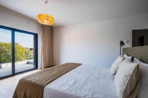 Postel nebo postele na pokoji v ubytování Casa Luminosa by Portugal Portfolio