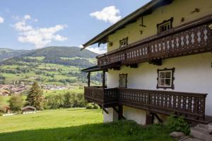 a building with a balcony on the side of it at Mountain-view Cottage Sleeps 15 -Balcony -Pets Ok in Bicheln