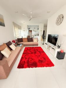 a living room with a couch and a red rug at Colombo City Escape 2BR Apartment - Nugegoda in Nugegoda