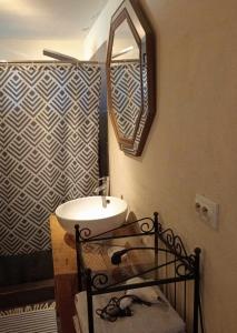a bathroom with a sink and a mirror at Quinta Cavaluz in Poceirão +23 photos