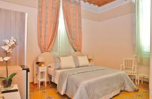 Postel nebo postele na pokoji v ubytování Lucca Relais