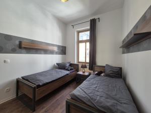 Postel nebo postele na pokoji v ubytování Mikra Homes24 in Gößnitz