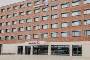 an image of the front of a red brick building at Premier Inn Karlsruhe City Am Wasserturm in Karlsruhe