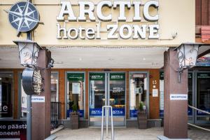 a hotel zone sign in front of a building at Hotel Arctic Zone in Ruka