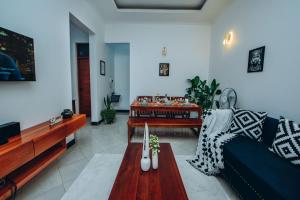 a living room with a couch and a table at Royal Homestay in Moshi
