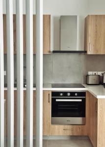 Kuchyň nebo kuchyňský kout v ubytování Grace Living + 34 fotografií