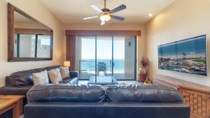 a living room with a couch and a ceiling fan at Rubi 805 1 BR 1BA Condo Phase 1 @ Las Palomas in Puerto Peñasco
