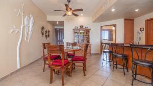 a kitchen and dining room with a table and chairs at Rubi 805 1 BR 1BA Condo Phase 1 @ Las Palomas in Puerto Peñasco