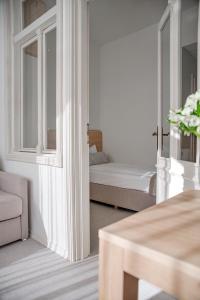 Una cama o camas en una habitación de Dom Zdrojowy