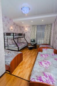 
a bedroom with a bed and a desk at Baza otdyha Dikiy Ray in Verkhniy Is
