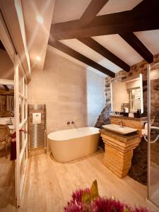 a large bathroom with a tub and a sink at La Quinta Luxury Palace in Arnuero