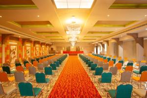 an empty hall with chairs and a red carpet at The Grand Sanvika in Ramakkalmedu +33 photos