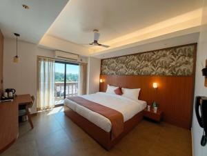 Postel nebo postele na pokoji v ubytování Hotel Srimanta sankardev + 16 fotografií