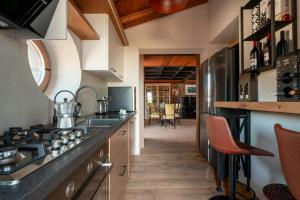 a kitchen with a stove and a counter top at Villa With Pool And Vineyards Among Etna Vineyards in Santa Maria di Licodia
