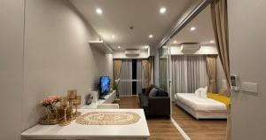 a living room with a couch and a bed at The one ratchaphruek in Ban Nong Bua +18 photos