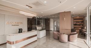 a salon with a counter and chairs in a room at The one ratchaphruek in Ban Nong Bua