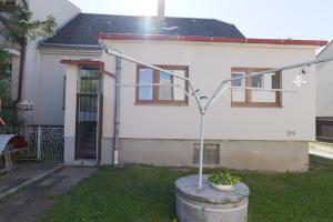 a house with a street light in front of it at Ubytování Lipová in Jihlava