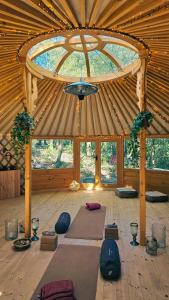 a room with a bunch of yoga mats on the floor at 16Th Century Farmhouse Between The Tuscan Hills in Brancorsi
