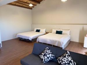 Ένα ή περισσότερα κρεβάτια σε δωμάτιο στο Jiufen Yunhai Yazhu Homestay +4 φωτογραφίες