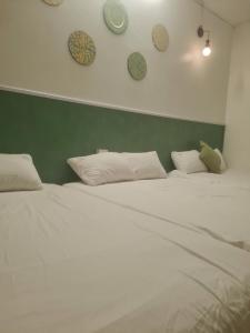 Postel nebo postele na pokoji v ubytování Cute Home + 5 fotografií