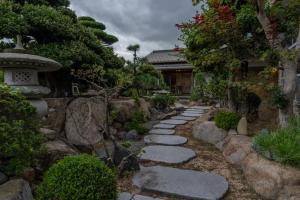 a stone path in a japanese garden at 蒼々さぬき志度 SOUSOU Sanuki Shido in Sanuki
