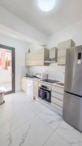 Køkken eller tekøkken på Pool Citylux Apartment