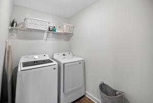 a kitchen with a stove and a dishwasher at Discovery Haven townhouse in Monrovia